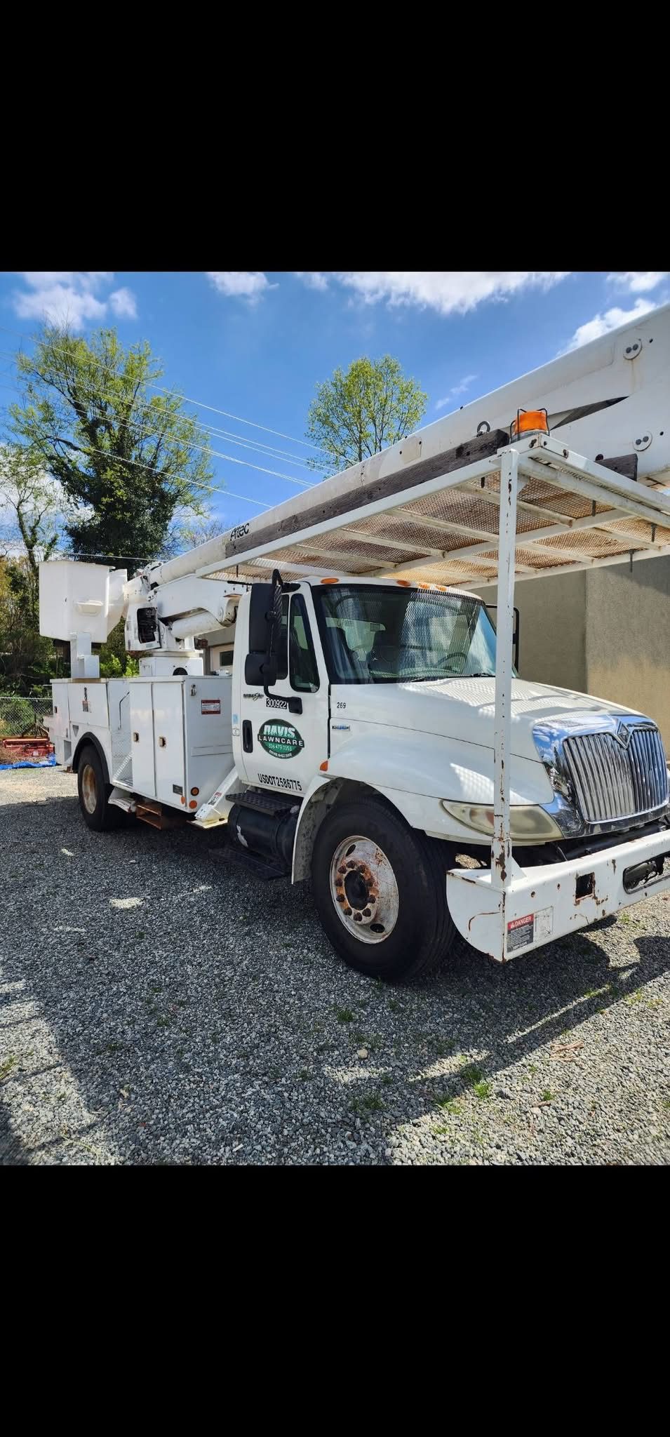 Davis Lawn Care branded bucket truck